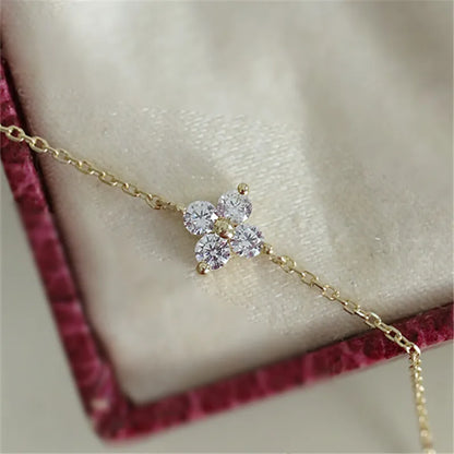 Pulseira dourada flor de zircônia, acabamento banhado a ouro 14K, Loja Simplicité