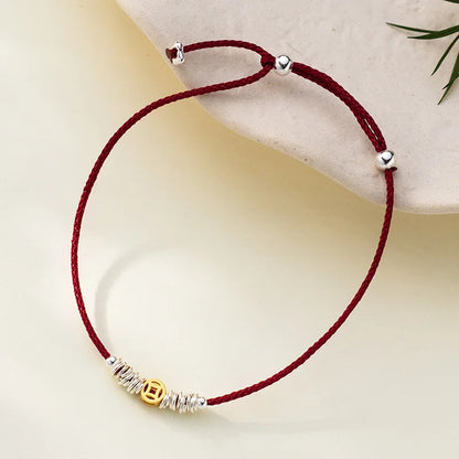 Pulseira dourada de moedas em cordão vermelho ajustável - Loja Simplicité