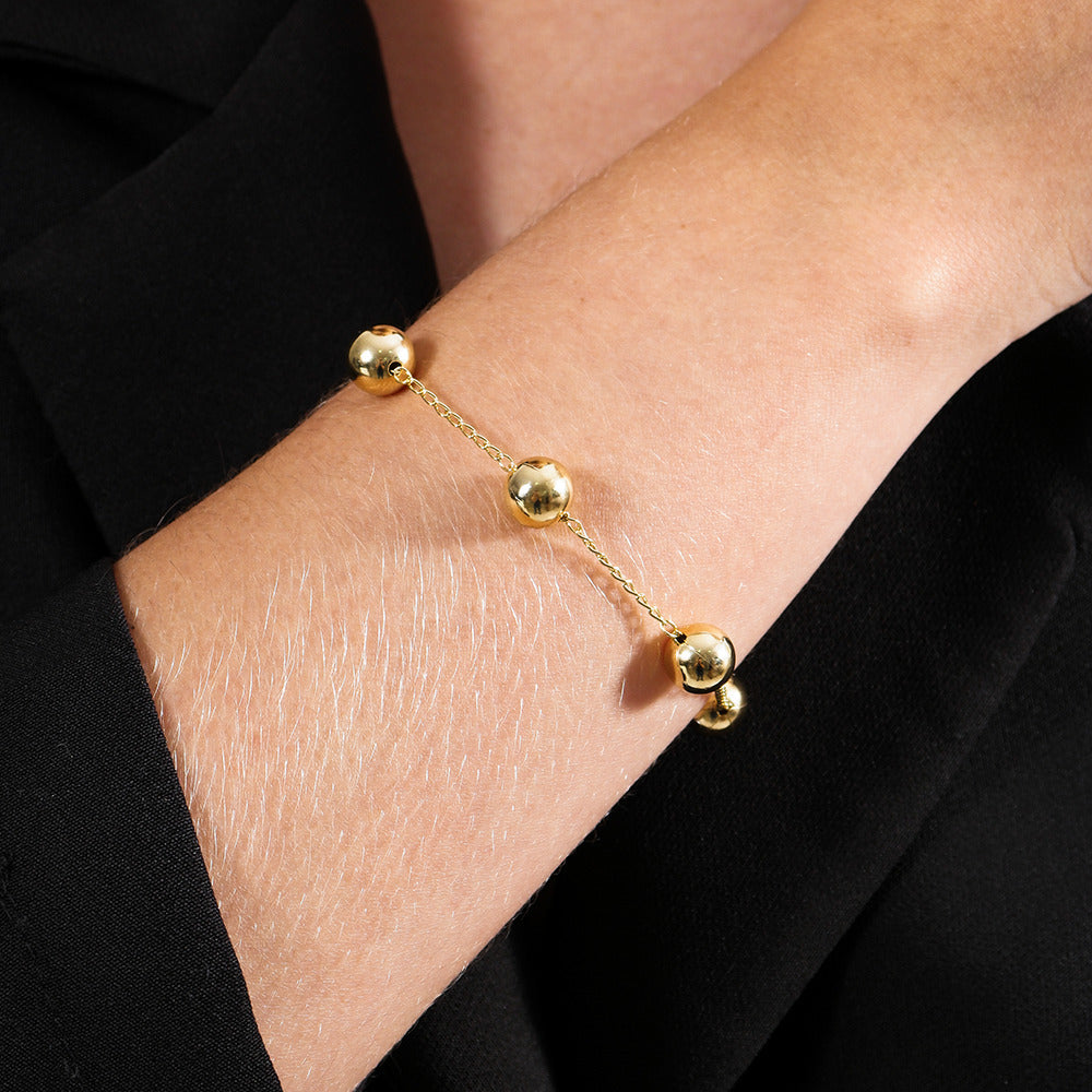 Pulseira dourada Grandes Sphères Simplicité em detalhe