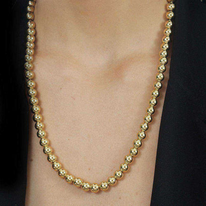 Colar dourado Sphères Dorées Simplicité em detalhe