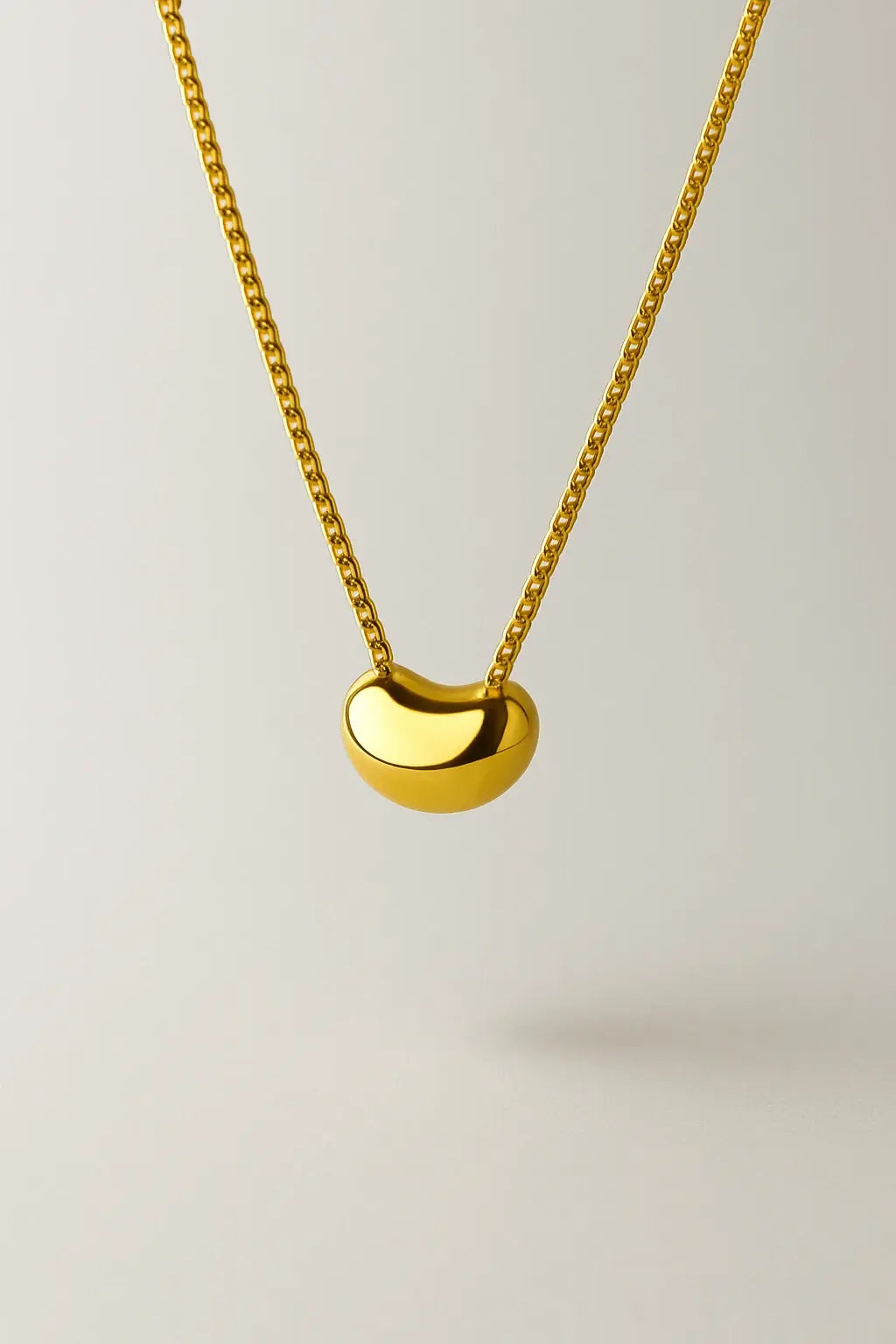 Colar semente da vida dourado vista frontal design natural minimalista fluido