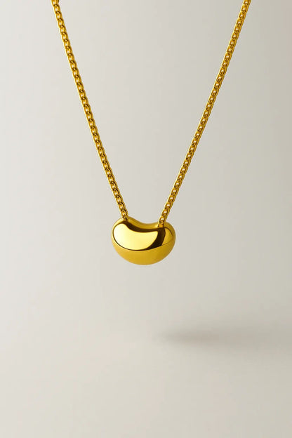 Colar semente da vida dourado vista frontal design natural minimalista fluido