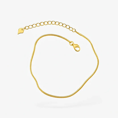 Tornozeleira snake bone dourada vista frontal design fluido líquido